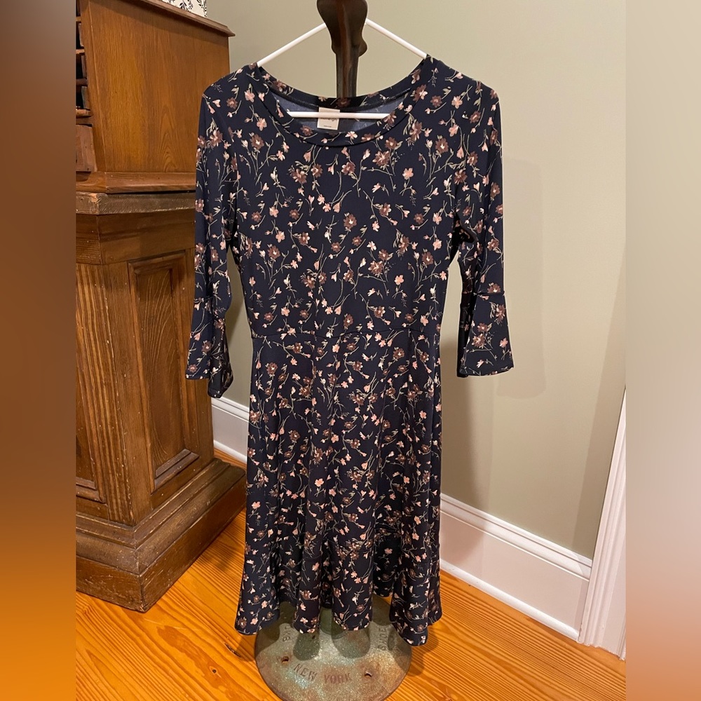 Navy dress with brown and green flower design.